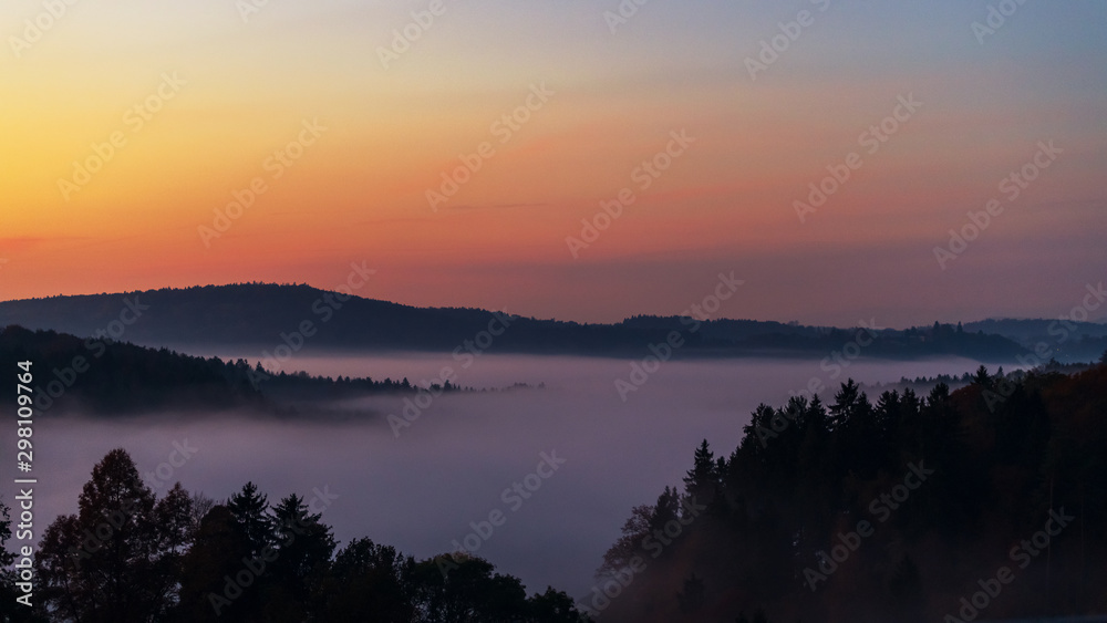 Foggy morning: sunrise over the forest-amazing landscape