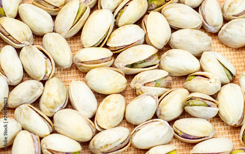 pistachios isolated on brown background. the view from the top