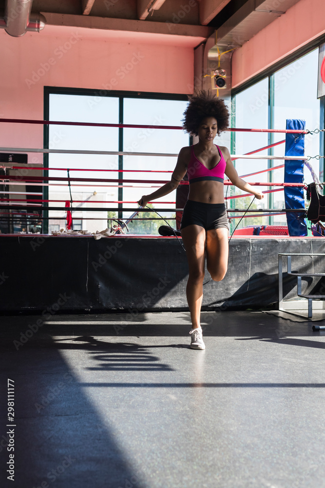 black woman jumping rope. black woman jumping rope.