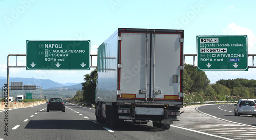 junction motorway with truck and italian traffic signal photo