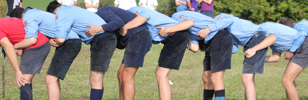 many boy with scout uniform playing at leapfrog outdoor many boy with scout uniform playing at leapfrog outdoor