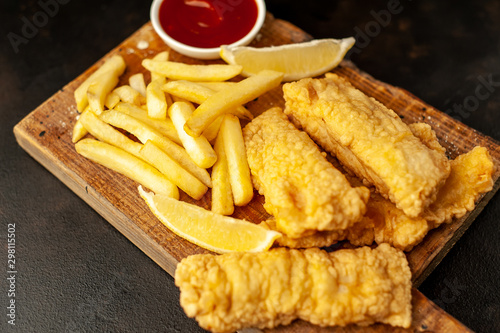 fish and chips with french fries, on a stone background  A photo