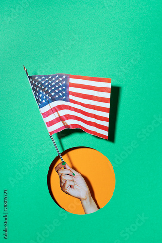 Hand holding a usa flag photo