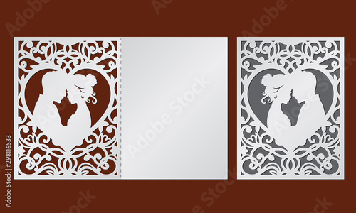 Valokuva Laser cut template of wedding invitation with bride and groom in the heart frame
