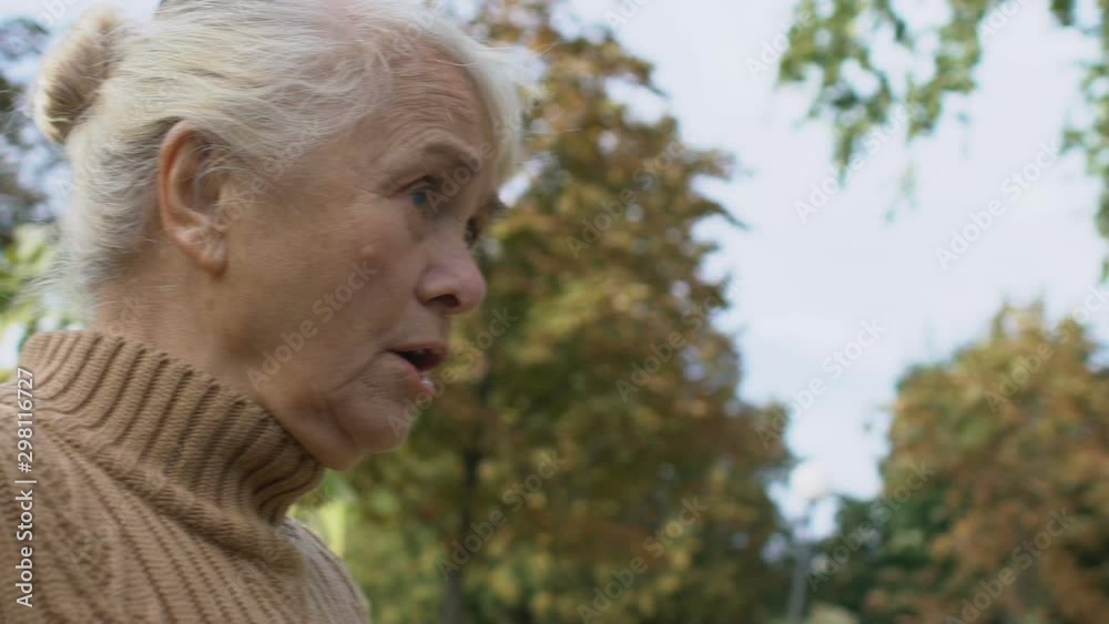 Old man and woman arguing and screaming at each other outdoor, slow-motion Old man and woman arguing and screaming at each other outdoor, slow-motion