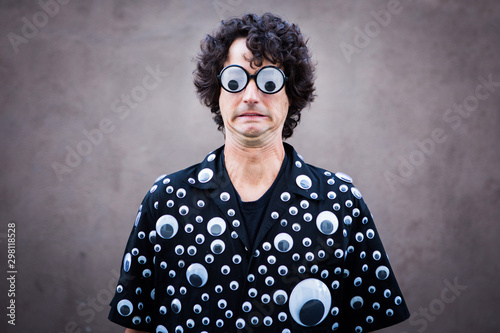Man Wearing Suit Covered in Googly Eyes