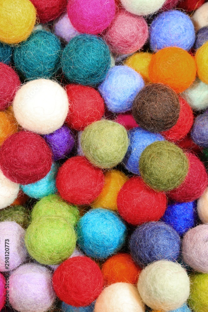background of felt balls used as christmas oranments background of felt balls used as christmas oranments