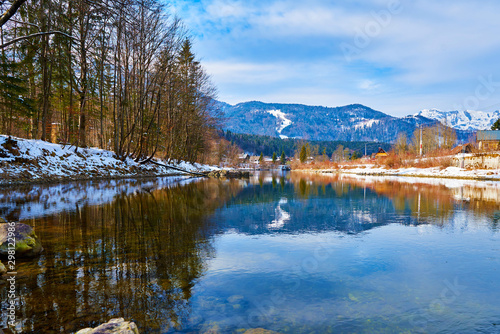 Scenic picture-postcard landscape with lake Traun, forest and mountains in Austrian Alps. Beautiful view in winter. Austria, Bad Goisern