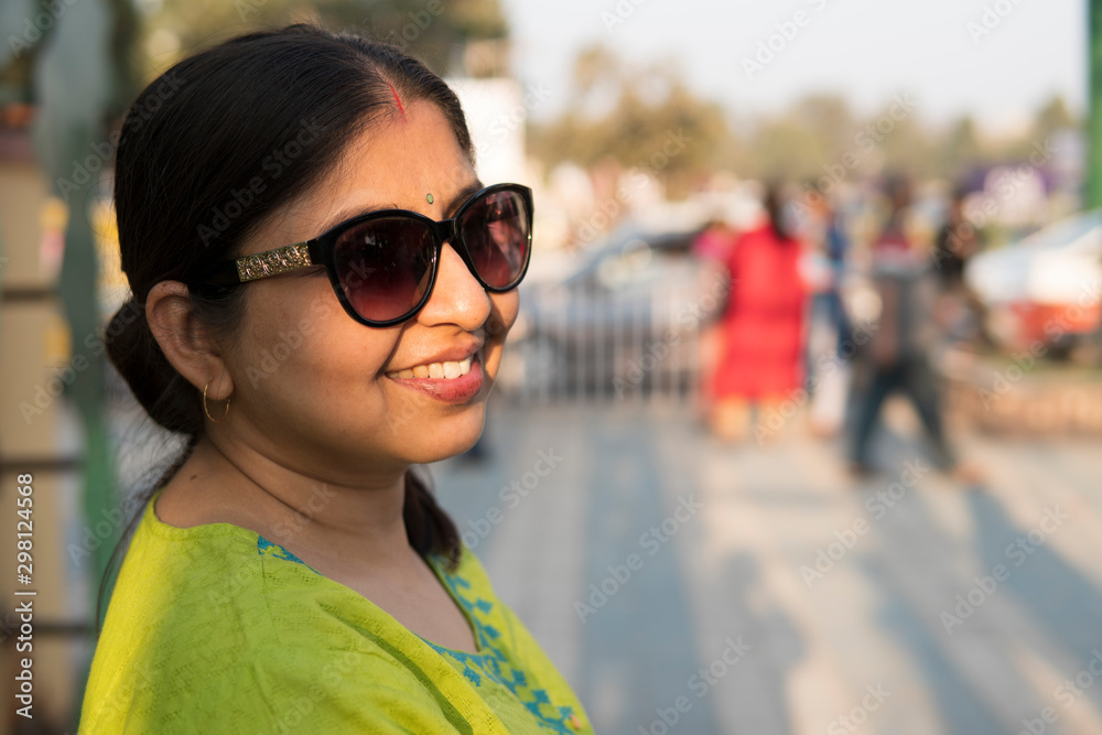 Woman wearing sunglasses and laughing in city Woman wearing sunglasses and laughing in city