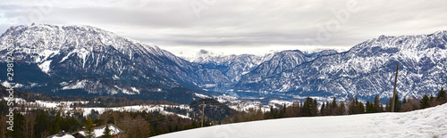 Panoramic mountain landscape of Hallstatt lake at ranny day in Austrian Alps, Salzkammergut region.