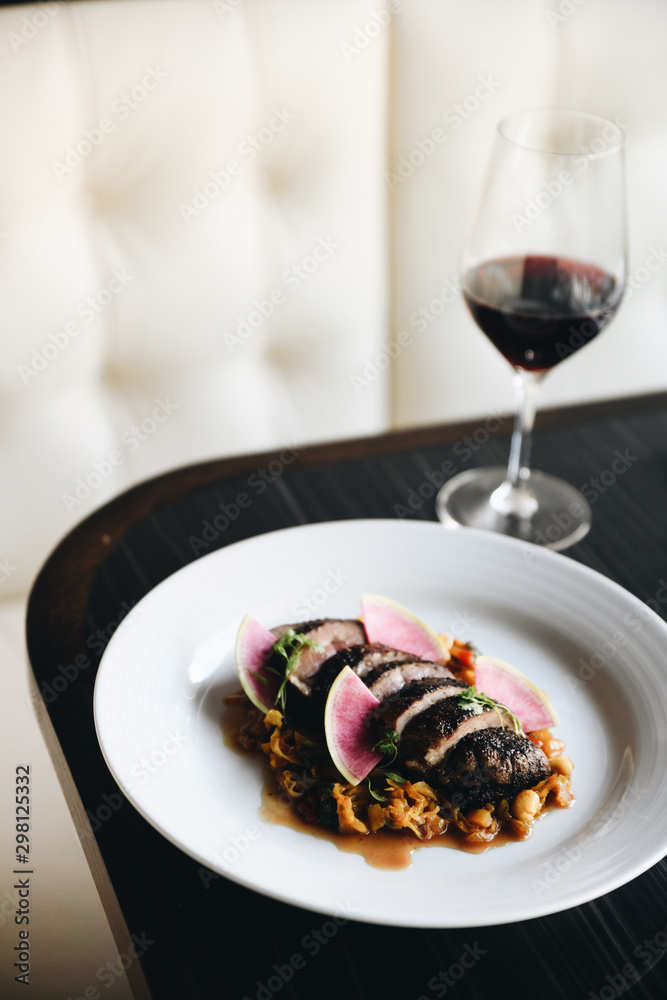 Roasted meat with red wine served on table Roasted meat with red wine served on table