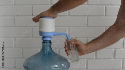 Hand water pump. Water pump for home and office use. Drinking Water bottles with manual pump dispensers.