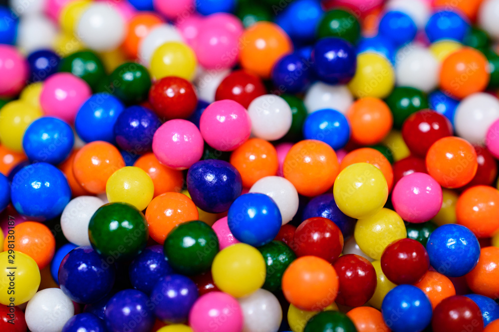 Close up of brightly colored rainbow candy sprinkles Close up of brightly colored rainbow candy sprinkles