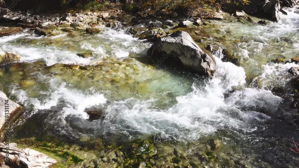 Mountain stream in The last Shangri la, Daocheng-yading, Beautiful Scenic of Yading Natural Reserve, Sichuan, China. in slow motion. Mountain stream in The last Shangri la, Daocheng-yading, Beautiful Scenic of Yading Natural Reserve, Sichuan, China. in slow motion.
