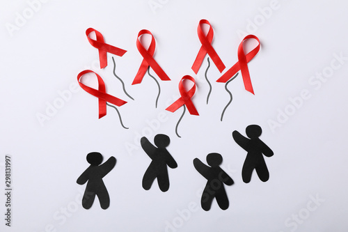 Awareness ribbons and people appliques on white background, space for text