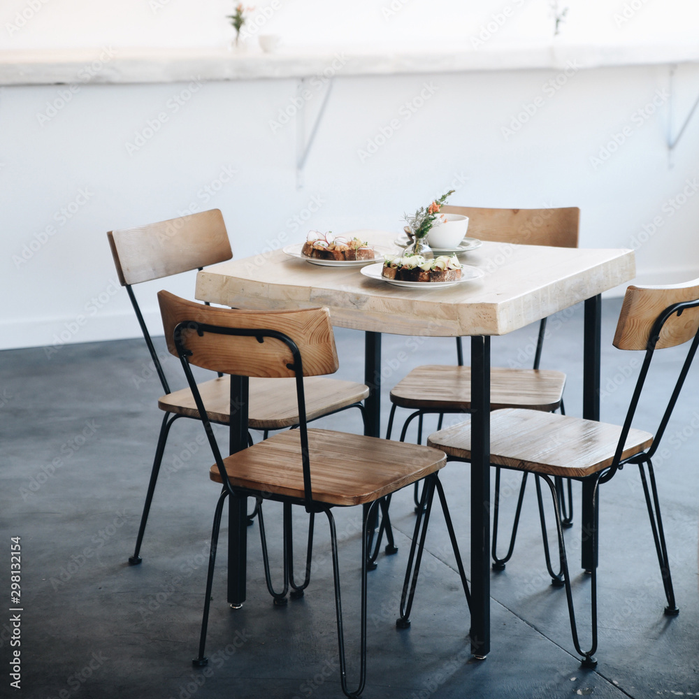 Table and chairs arranged with food Table and chairs arranged with food