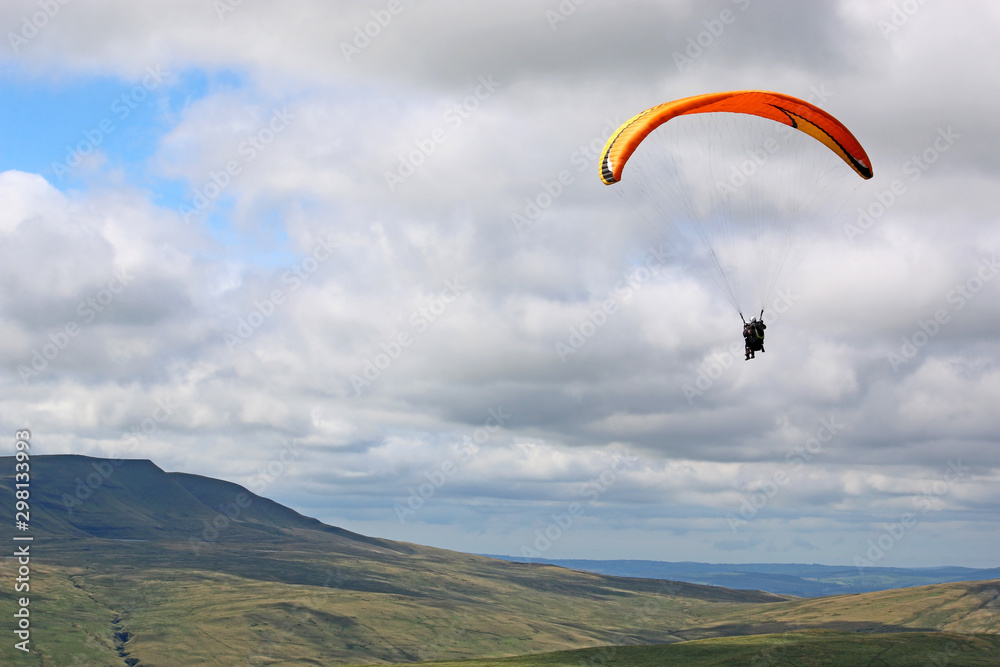 Tandem Paraglider in the Brecon Beacons, Wales Tandem Paraglider in the Brecon Beacons, Wales