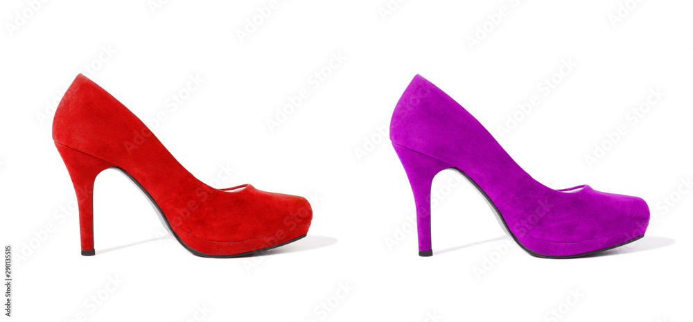 Closeup of fashionable high heels red and pink shoes isolated on white background. Red color woman shoe on floor. Shopping and fashion concept. Copy space. Selective focus Closeup of fashionable high heels red and pink shoes isolated on white background. Red color woman shoe on floor. Shopping and fashion concept. Copy space. Selective focus