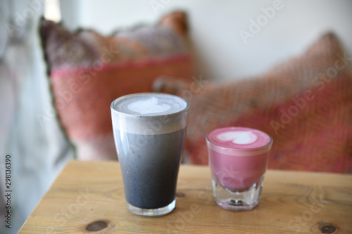Toasted black sesame latte and beet latte served on table photo