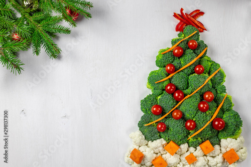 Edible Christmas tree shaped vegetable isolated on white background for holiday seasonal festive party celebration with healthy food decoration. Cooking step by step