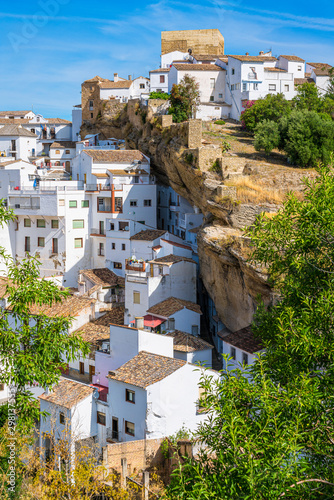 The beautiful village of Setenil de las Bodegas on a sunny summer morning. Provice of Cadiz, Andalusia, Spain. photo