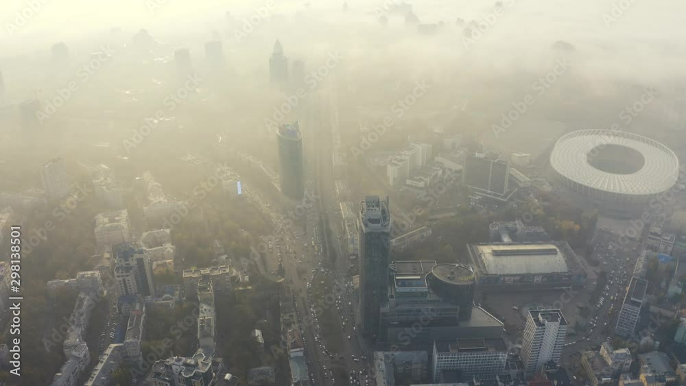 Aerial view of very dense morning fog in city Kiev. Smog or fog in big city. Problem of pollution of the environment. Olypmic stadium 4k