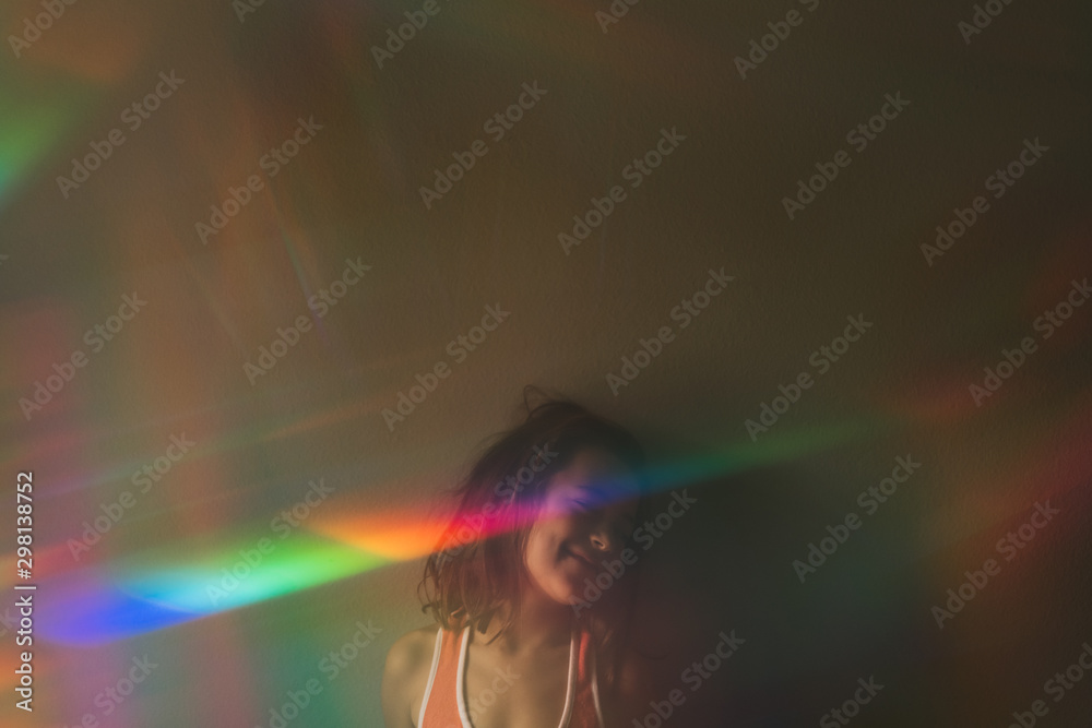 A Happy Girl With A Rainbow Across Her Face and Messy Hair A Happy Girl With A Rainbow Across Her Face and Messy Hair