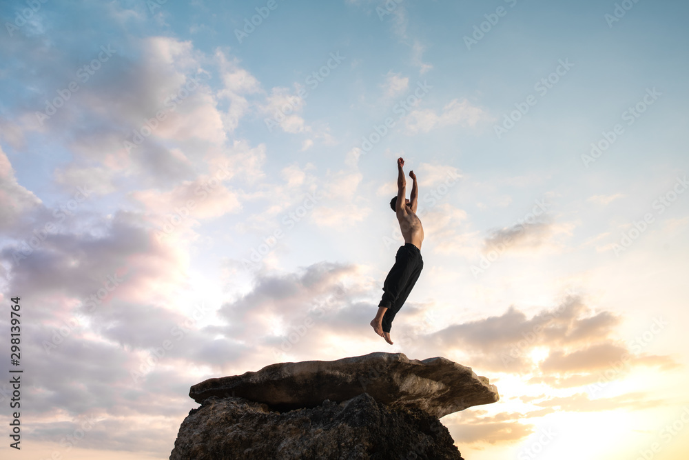 Man jumping up to the sky.