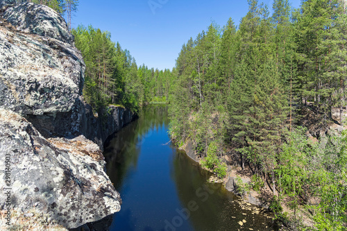 Forest lake in a rocky canyon.