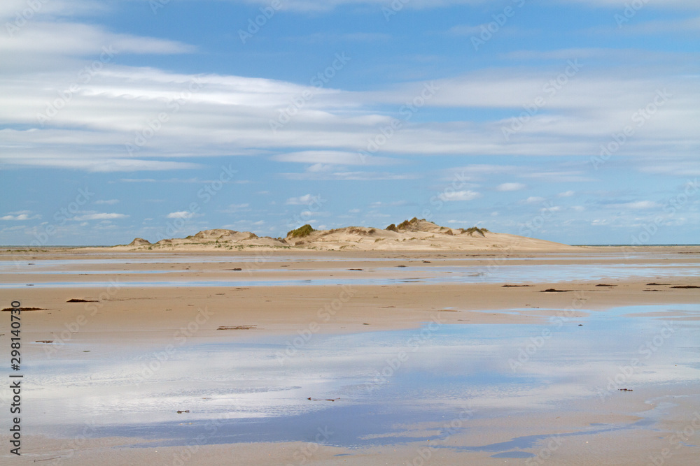 Dune on wide beach plain of the Dutch island Terschelling