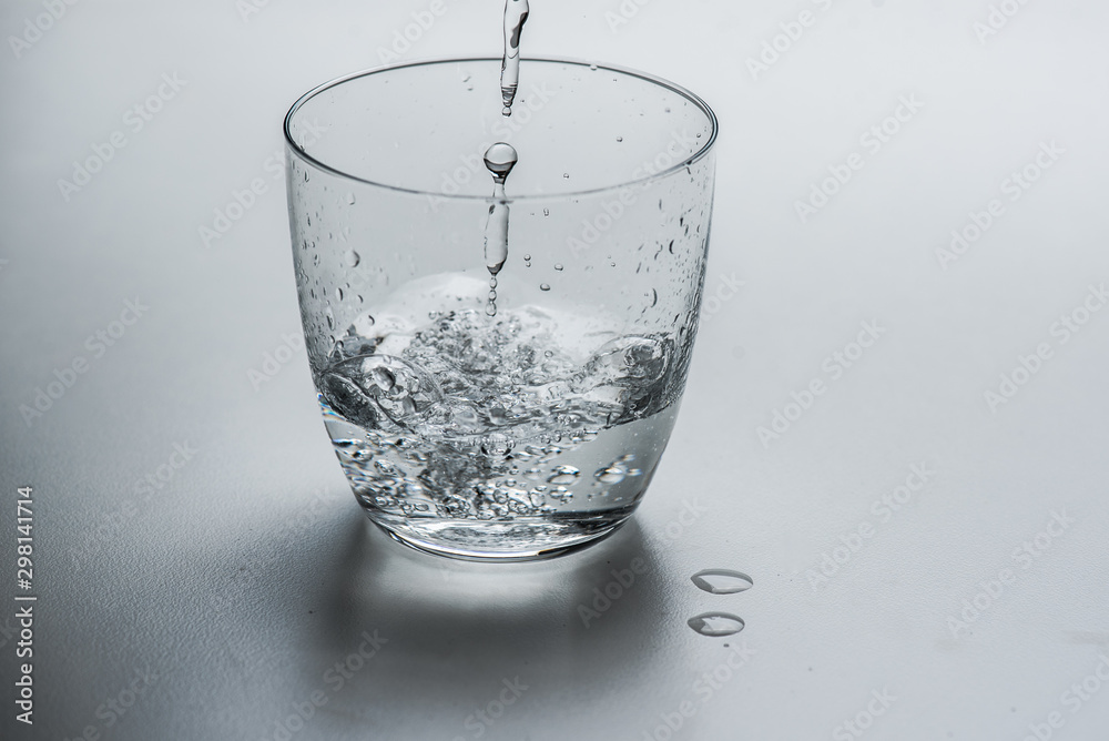 glass with water on a white background