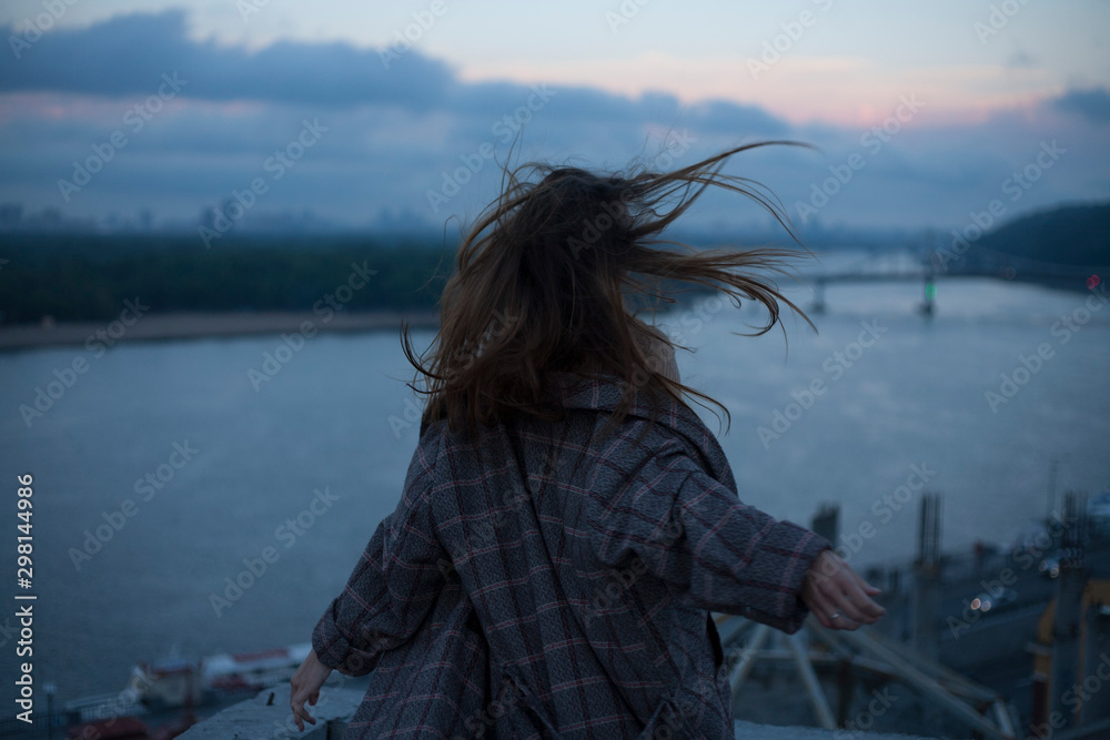 girl with flying hair on the background of the night city girl with flying hair on the background of the night city
