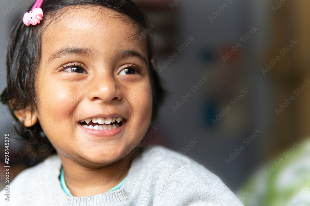 Portrait of a happy little girl laughing and smiling Portrait of a happy little girl laughing and smiling