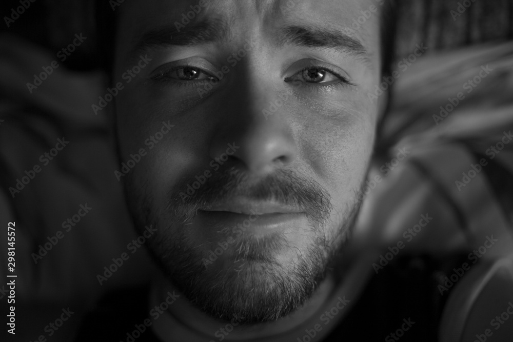 portrait of a sad man crying at the camera portrait of a sad man crying at the camera