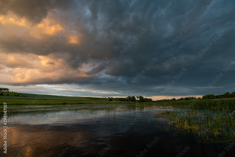 Naklejka premium river and sunset