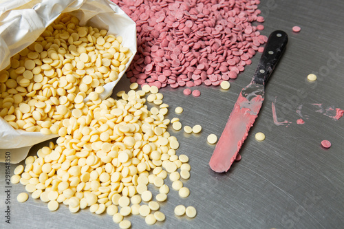 Pink and white chocolate pistoles . photo