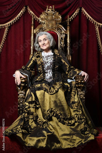 Portrait of beautiful senior woman Queen, indoors