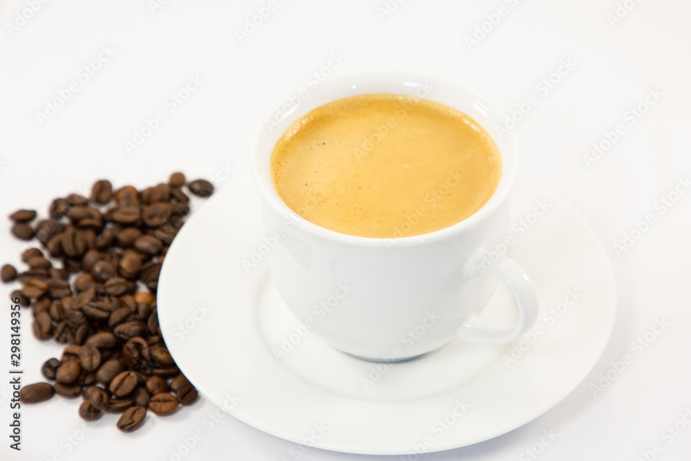 Coffee cup and beans close-up isolated on a white background. Coffee cup and beans close-up isolated on a white background.