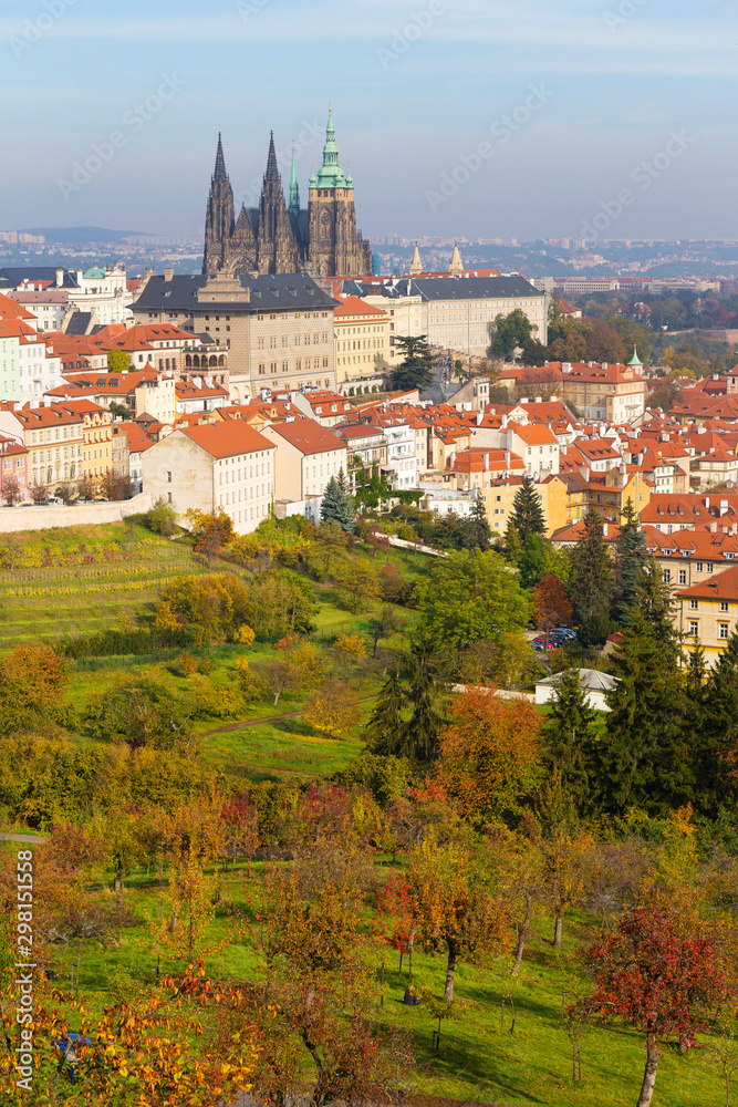 Obraz premium Autumn Prague City with gothic Castle and colorful Nature and Trees from the Hill Petrin, Czech Republic