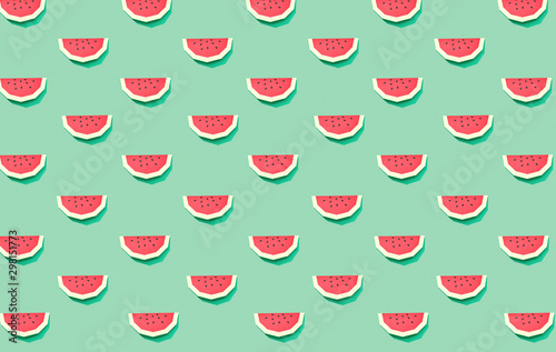 Creative summer pattern sweet slice watermelon of paper on a green background. Flat lay. Helthy food concept, origami paper fruit.