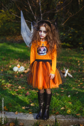 Little girl transformed into scary zombies  dressed for Halloween.