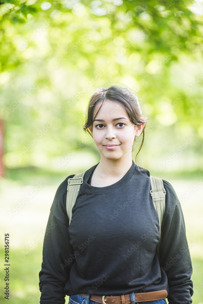 Portrait of smiling young woman standing outdoors Portrait of smiling young woman standing outdoors