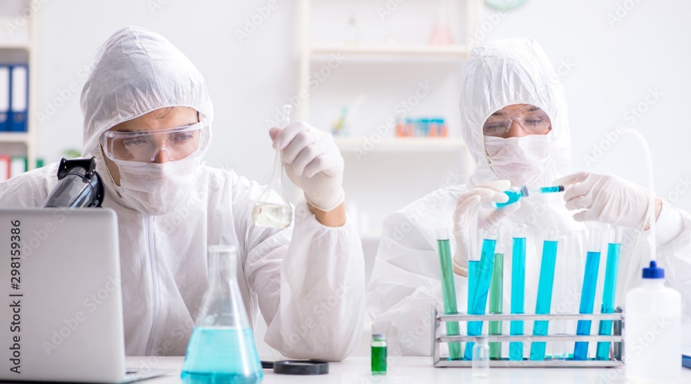 The two chemists working in the lab The two chemists working in the lab