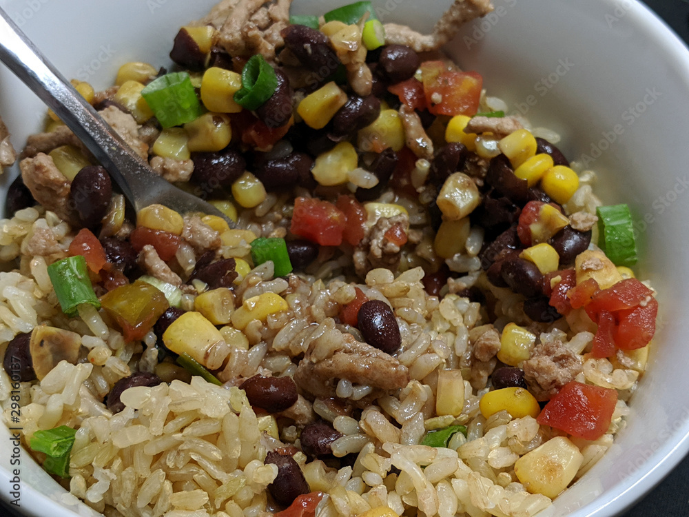 Ground Turkey, Corn, and Black Beans Over Rice in White Bowl Ground Turkey, Corn, and Black Beans Over Rice in White Bowl