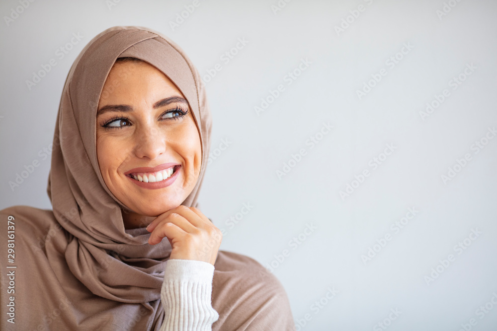 Portrait of pretty young asian muslim woman in head scarf smile. Pearl From The East. Smiling Muslim Woman Wearing Hijab. Modern, Stylish and Happy Muslim Woman Wearing a Headscarf Portrait of pretty young asian muslim woman in head scarf smile. Pearl From The East. Smiling Muslim Woman Wearing Hijab. Modern, Stylish and Happy Muslim Woman Wearing a Headscarf