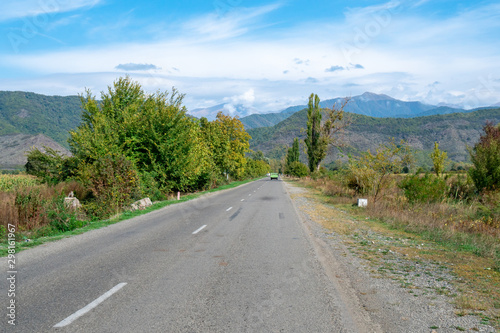 Road to mount Caucasus along with the leaf shredded trees at the side of the road. Kakheti  Georgia.