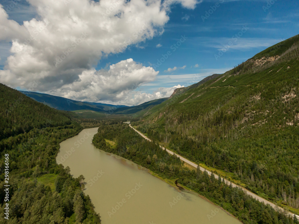 Aerial Panoramic View of a Scenic Highway in the Valley surrounded by Canadian Mountain Landscape. Taken near Clearwater, North of Kamloops, British Columbia, Canada.