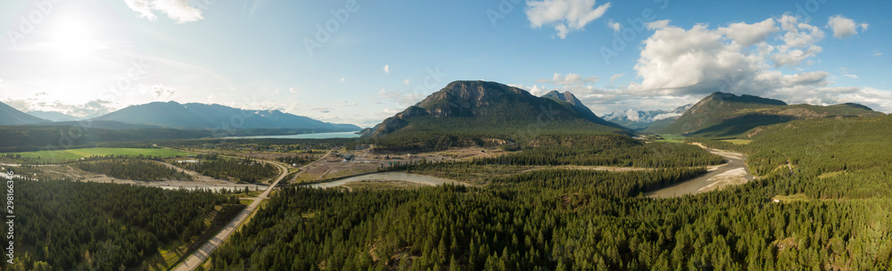 Aerial Panoramic View of Small Town, Canal Flats, during a sunny and cloudy summer day. Located in the Kootenay, British Columbia, Canada. Aerial Panoramic View of Small Town, Canal Flats, during a sunny and cloudy summer day. Located in the Kootenay, British Columbia, Canada.