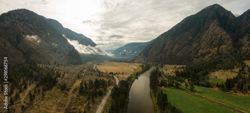 Aerial Panoramic View of a scenic Highway in the Valley surrounded by Canadian Mountain Landscape. Taken near Keremeos, British Columbia, Canada. photo