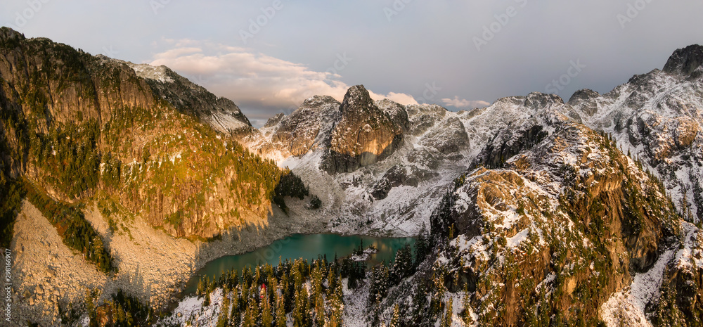 Obraz premium Aerial Panoramic View of Beautiful Canadian Mountain Landscape during a sunny sunset. Taken near Squamish, North of Vancouver, British Columbia, Canada.